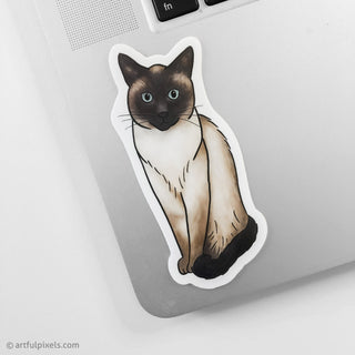 Siamese cat sticker placed on corner of laptop